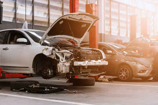 closeup car in repair station and body shop with soft-focus and over light in the background