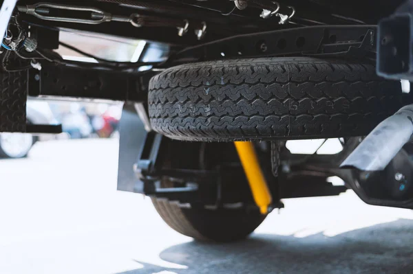 closeup car spare tire with soft-focus and over light in the background