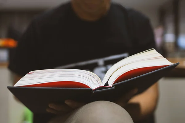 Young Man Sitting Reading Window Room Soft Focus Light Background — Stock Photo, Image