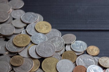 Thai money on black wood table. top view