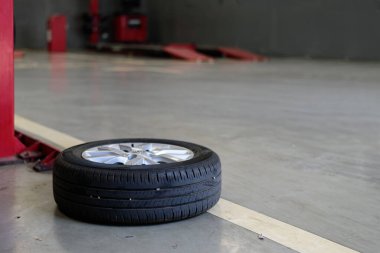 alloy wheels at the garage with soft-focus and over light in the background