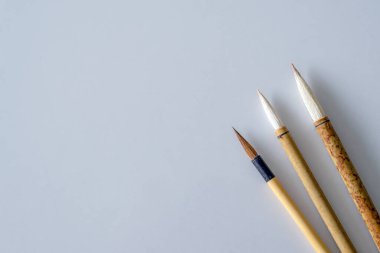 Japan traditional writing brush on table. top view and over light