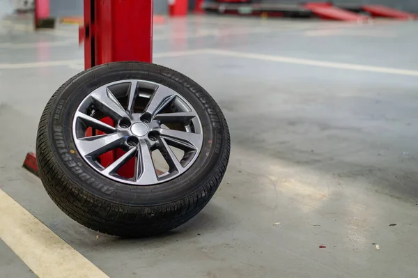 CHIANG RAI, THAILAND-APRIL 15, 2018, closeup bridgestone tire in garage with soft-focus and over light in the background