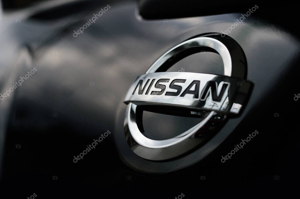 CHIANG RAI, THAILAND-APRIL 18, 2018, closeup logo nissan car with soft-focus and over light in the background