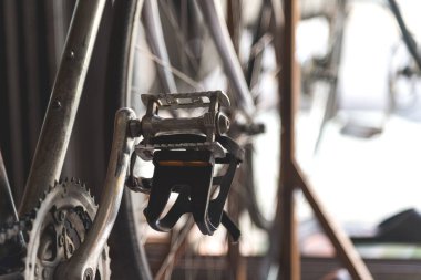 closeup vintage bicycle with soft-focus and over light in the background