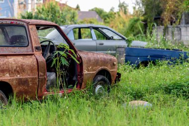 old car wreck with soft-focus and over light in the background