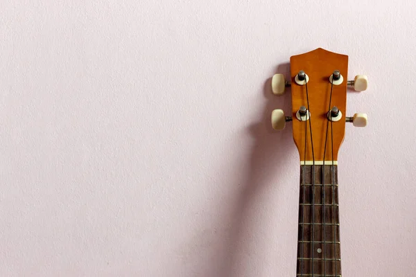 Closeup Ukulele Pink Background — Stockfoto