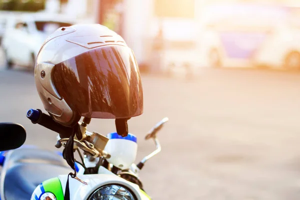 drive safely, wear a helmet concept. soft-focus and overlight in the background