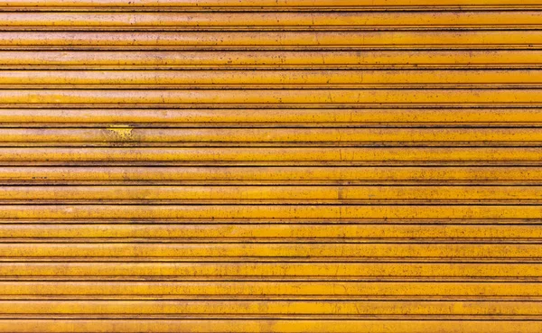 Closeup Old Yellow Rolling Metal Door Background — Stock Photo, Image