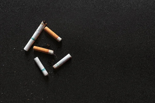 world no tobacco day concept. cigarettes on black wood table