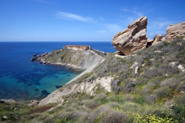 Rocky cliffs of Gnejna Bay, Golden Bay, Malta clipart