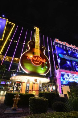 Las Vegas, Nevada - July 25, 2017: Night view of The Hard Rock Cafe on the Strip. The Hard Rock sign is embedded in a Gibson Les Paul Guitar III in Las Vegas on July 25, 2017 clipart