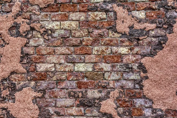 Old brick wall with peeling plaster. — Stock Photo, Image