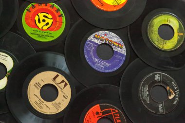 WOODBRIDGE, NEW JERSEY - October 11, 2018: A collection of 1960s 45 speed records, including the Beatles, Don McLean, Four Tops, Aretha Franklin, and Creedence Clearwater Revival.