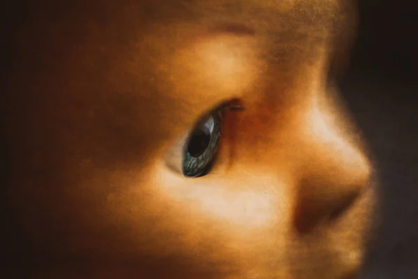 A closeup image of a creepy doll\'s eyeball.