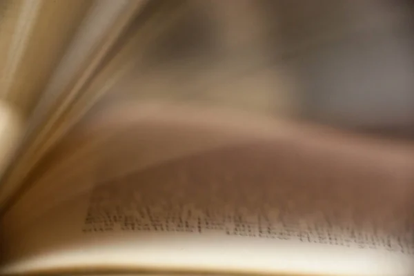 A unique view of book pages turning with a blur to show motion