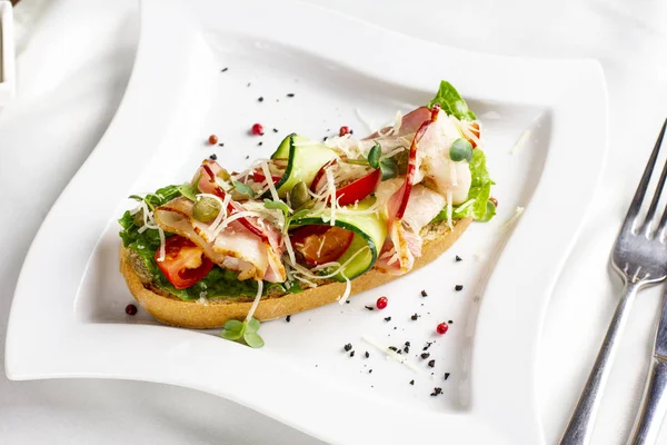 Bruschetta Bacon Fresh Vegetables Capers White Plate — Stock Photo, Image