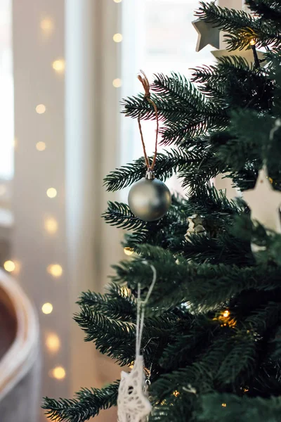 Decorated Christmas tree, minimalist Scandinavian decor background