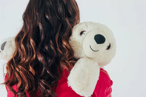 Polar Bear Toy Hugs Young Curly Brunette Woman Bright Pink — Stock Photo, Image