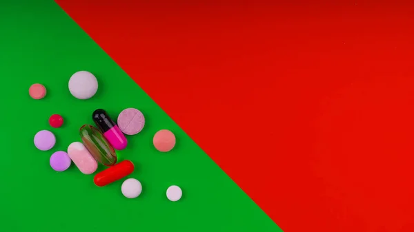 Colored pills on a bright background