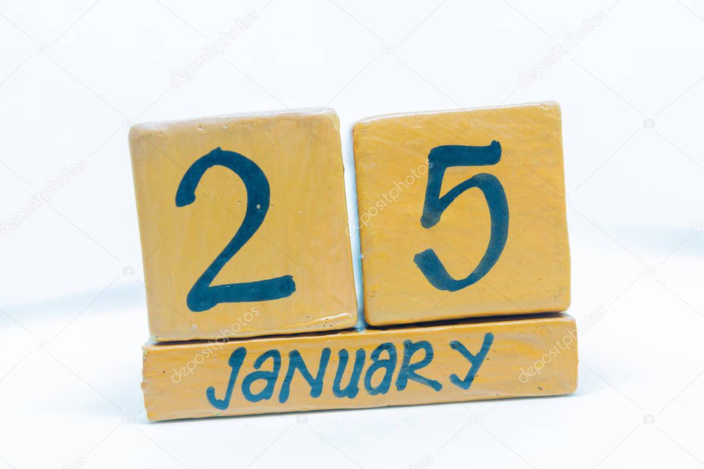 January 25th. Day 25 of month, calendar on wooden background. Winter time, year concept