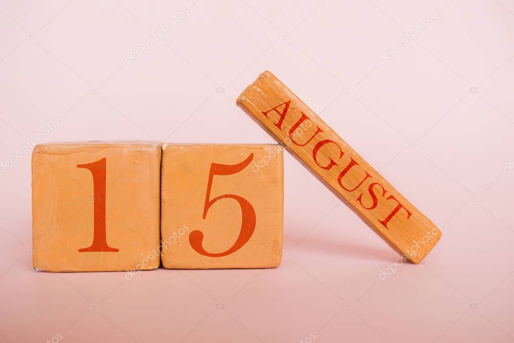 august 15th. Day 15 of month, handmade wood calendar  on modern color background. summer month, day of the year concept