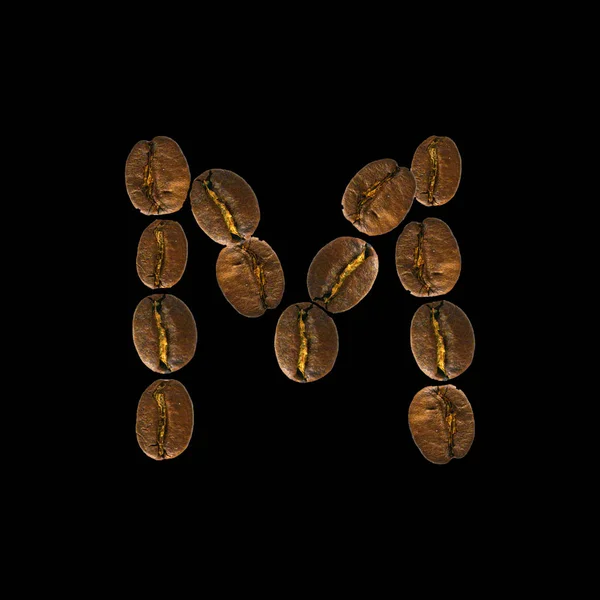 Conceito alfabeto fonte de café isolado no fundo branco. Top view Alfabeto feito de grãos de café torrados. Carta M — Fotografia de Stock