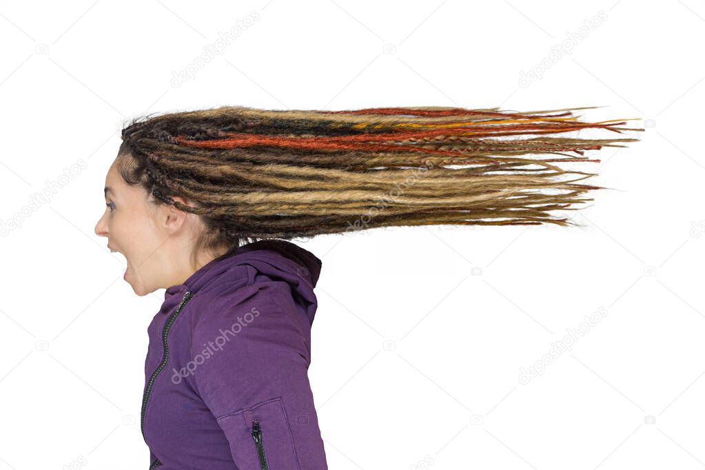 Portrait of beautiful screaming caucasian woman or girl with great dreadlocks. - isolated on white. hair fly back like from wind or big speed. the concept of maximum emotions or feelings