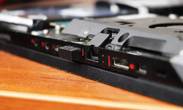 Computer repair: master repairs laptop
