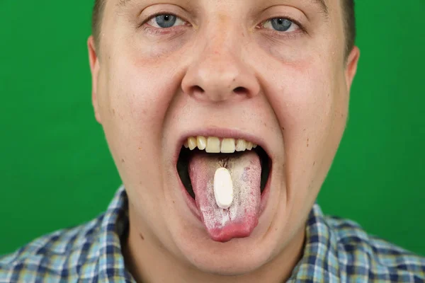 Young Man Taking Pill — Stock Photo, Image
