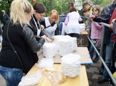 NIKOPOL, UKRAINE - MAY, 2019: distribution of food to the needy, charity event clipart