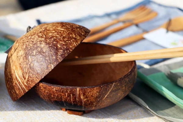 Traditional Chinese dishes - a plate of coconut. Eco-dishes: a bowl of coconut scarlet, Chinese chopsticks.