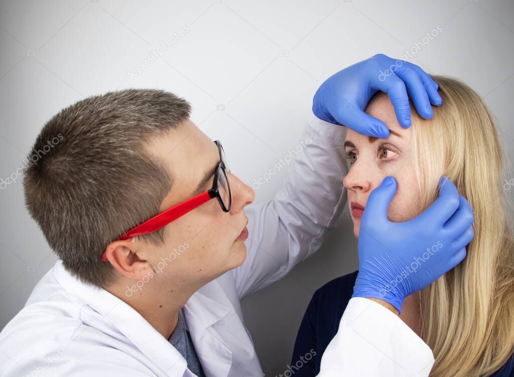 An ophthalmologist examines a woman who complains of a burning sensation and pain in her eyes. Eye fatigue from a computer screen or telephone (sand sensation on the cornea). The concept of early diagnosis of glaucoma