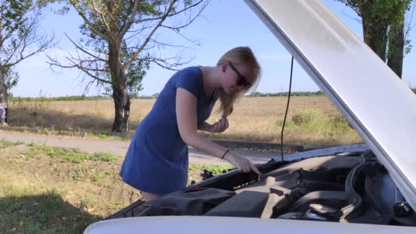 Blonde Girl Looks Engine Which Does Work Woman Touches Parts — Stock Video