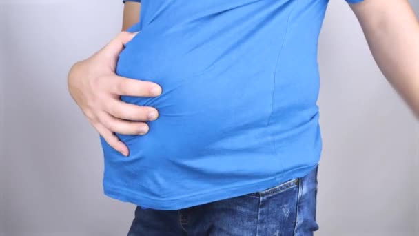 Conceptual Video Man Crumples His Huge Swollen Belly Trying Get — Stock Video