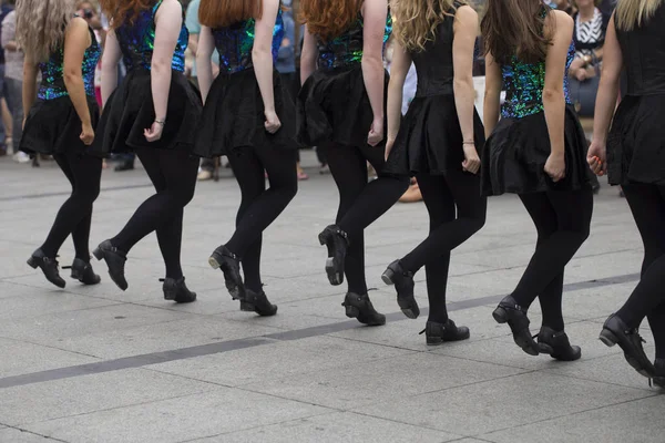 Irish dancers are dancing