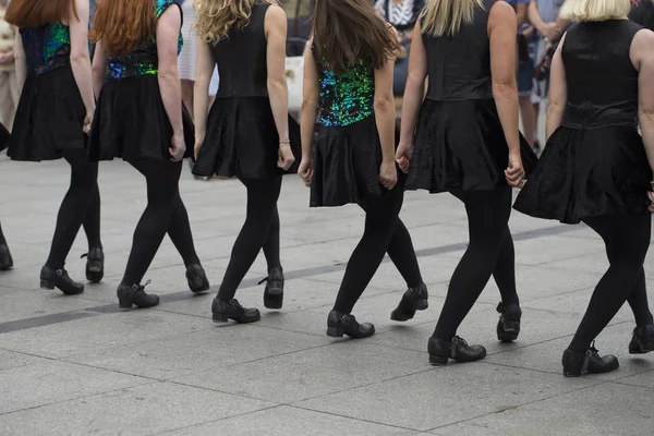 Irish dancers are dancing