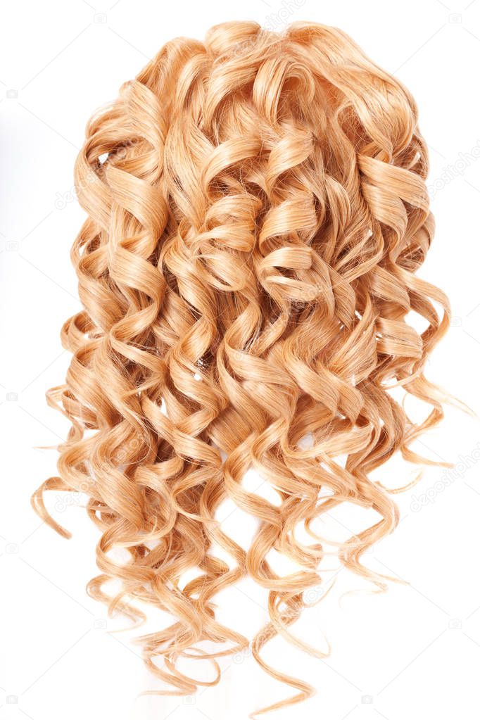 Curly hair. Healthy shiny voluminous hair on a white background