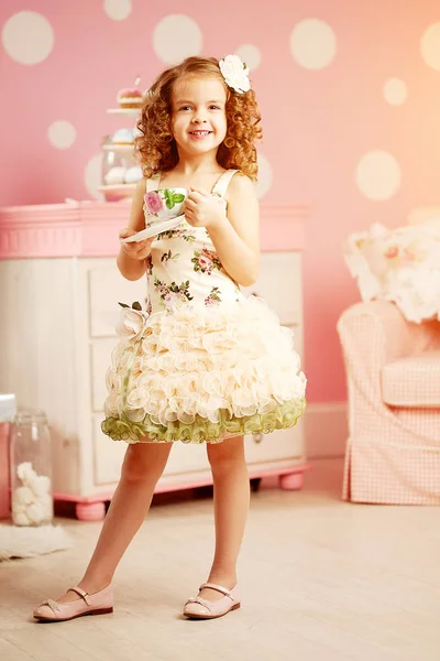 Little Cute Girl Pink Dress Drinks Tea Sweets Children Room — Zdjęcie stockowe