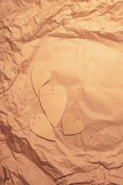 Wooden Hearts Crumpled Kraft Paper — Stock Photo, Image