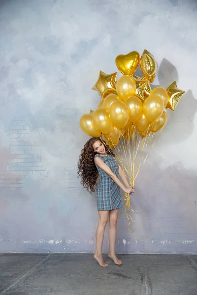 Young Slim Woman Holding Golden Balloons — Stock Photo, Image