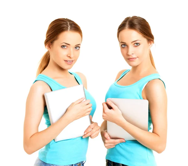 Twins Girls Models Two Smiling Women Holding Tablet Computer Isolated — Stock Photo, Image