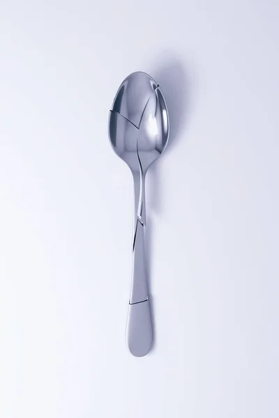 Silver broken spoon on table. 3d render — Stock Photo, Image