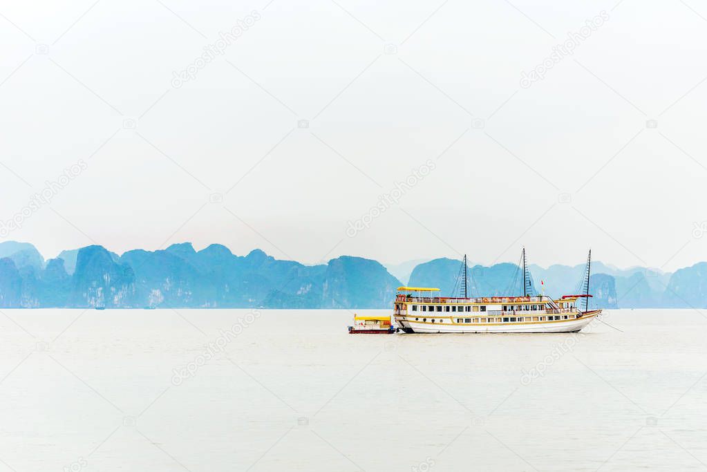 View of tourist ships in the bay, Halong, Vietnam. Copy space for text