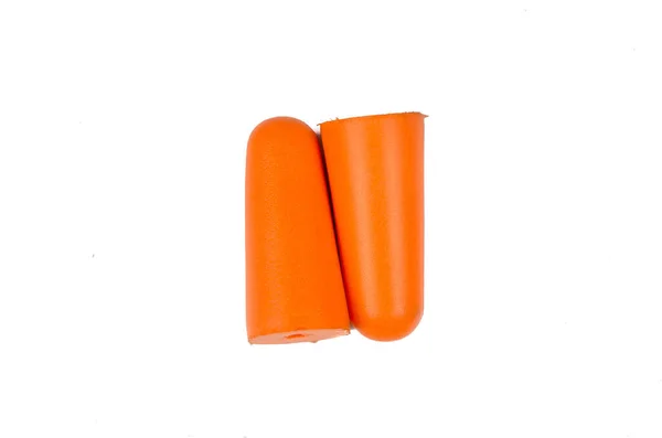 Ear plugs isolated on white background. Orange ear plugs isolated. Selective focus.