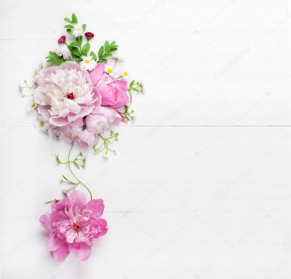 Bouquet of beautiful pink peonies on white wooden background. Top view. Copy space