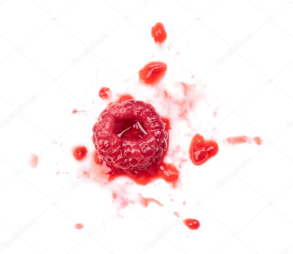 Smashed raspberries isolated on white