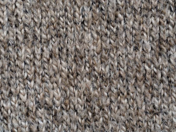 Light brown handmade wool knitting pattern Royalty Free Stock Photos