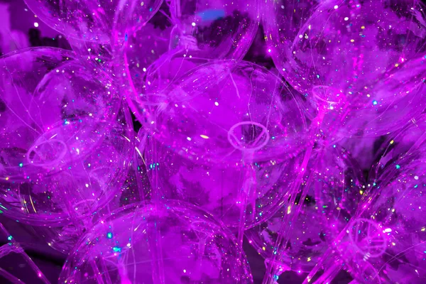 Purple background of glowing balloons