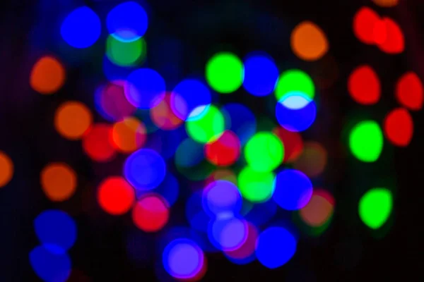 The dark festive blurred background has bokeh — Stock Photo, Image